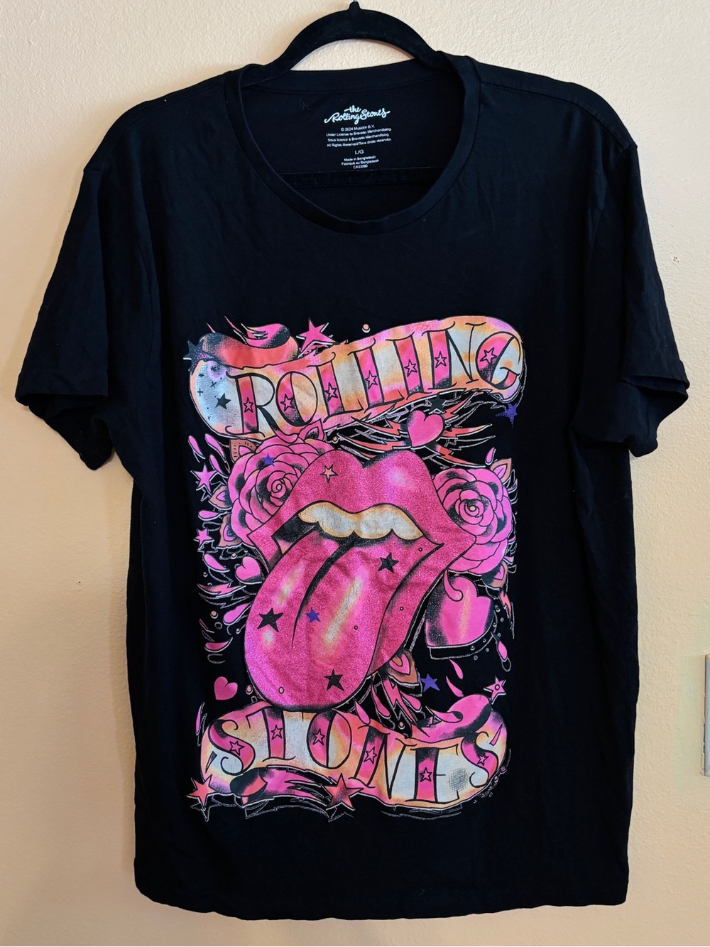 the Rolling Stones Black Tee with Pink and Gold Graphic